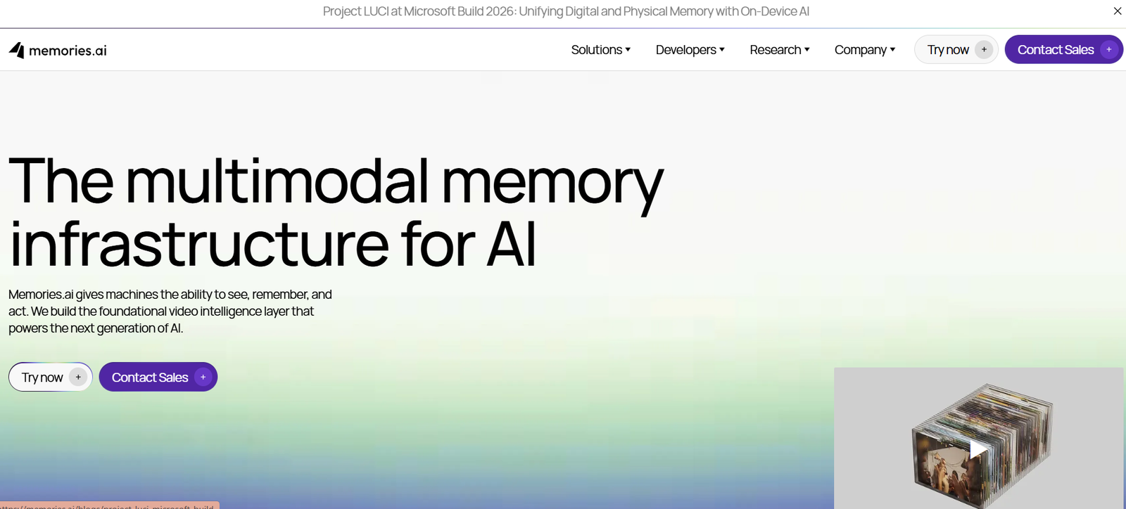16 - Hero banner for memories.ai: large headline 'The multimodal memory infrastructure for AI' with a short description on a gradient background; bottom-right shows a 3D stack of photo/video thumbnails.