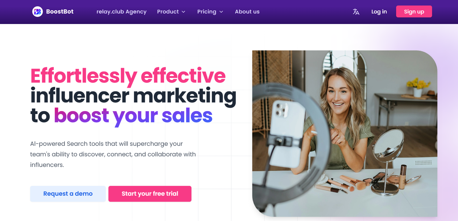 Hero header with bold marketing text on the left and a smiling woman filming a video on the right, using a ring light and phone setup.