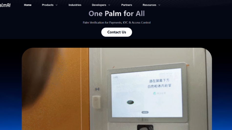 50 - Touchscreen payment terminal mounted on a wall, displaying Chinese text on the screen alongside a card reader below.